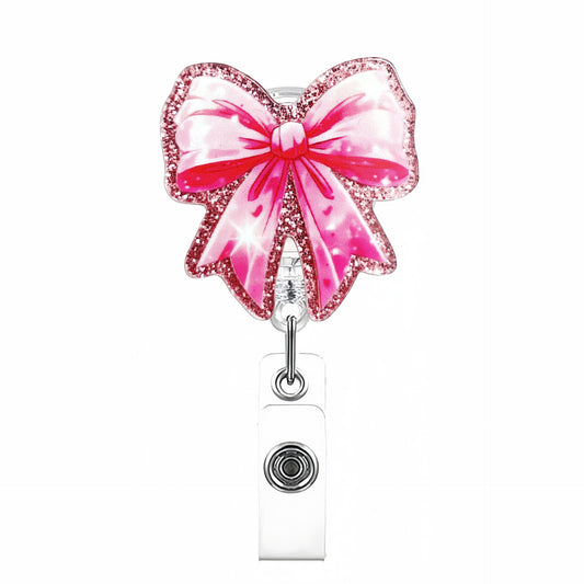 Acrylic Pink Background with Sparkles Bow Badge Reel